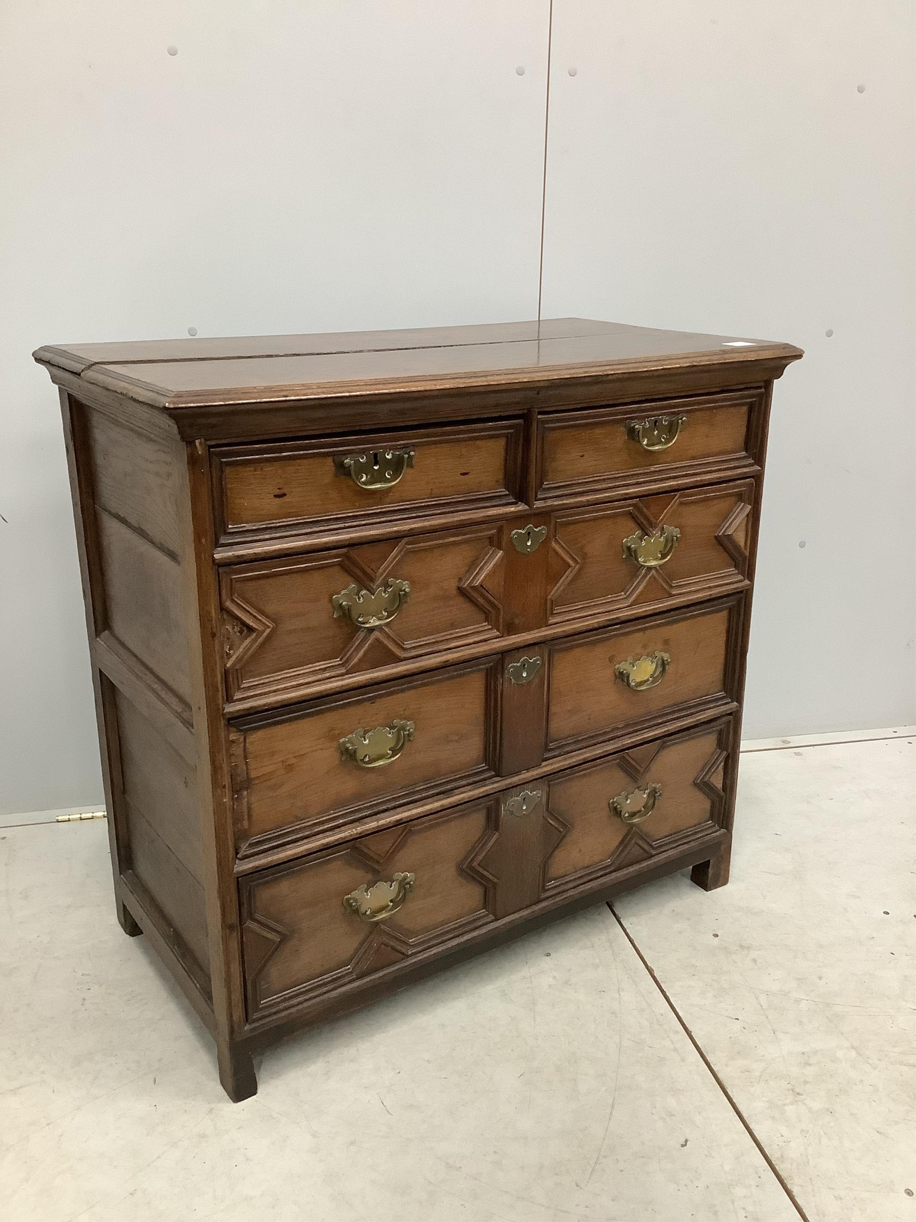 A Carolean geometric moulded oak chest of drawers, width 97cm, depth 51cm, height 91cm. Condition - poor